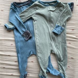 Two cloud island footie pajamas. Size 0-3 months
